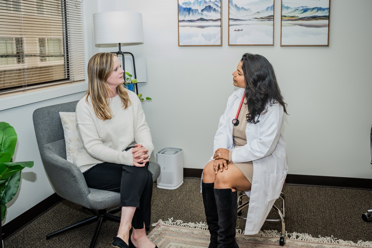 Dr. Neha in conversation with a patient